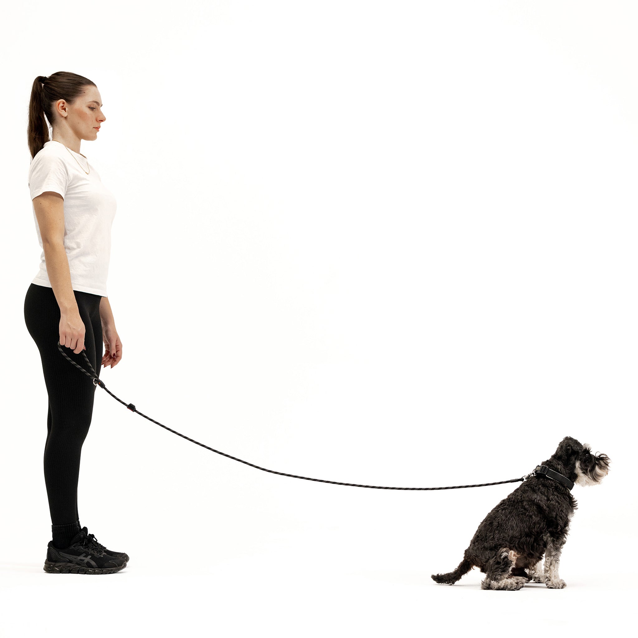 Woman holding a dog with Marine Leash LITE