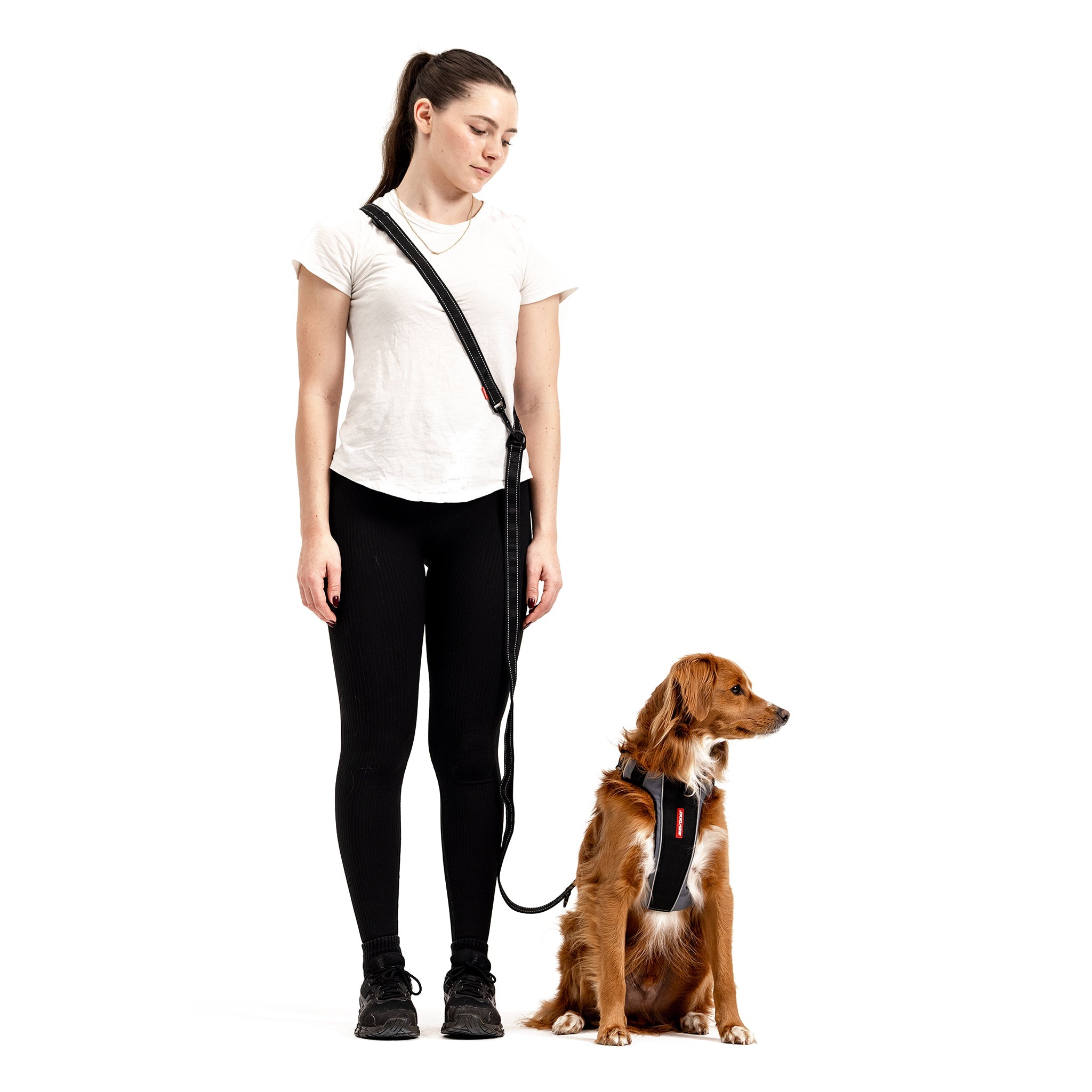 Woman standing next to a dog with Vario 6 Multi-Function Leash