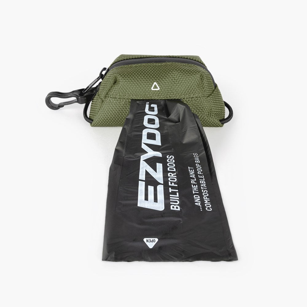 Green pet waste bag dispenser with EZYDOG branded black drawstring bag on a white background