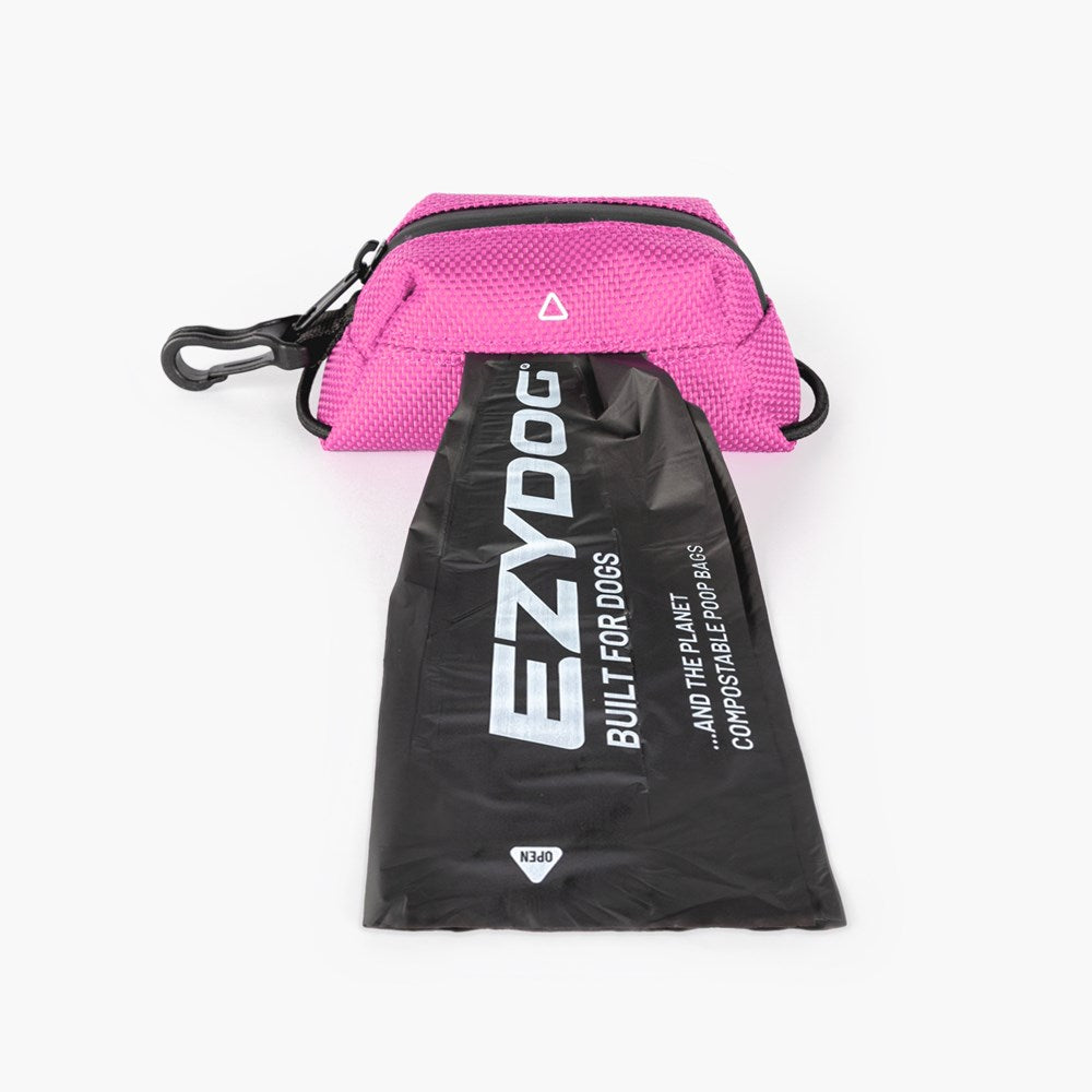 Pink pet waste bag dispenser with black drawstring bag featuring 'EzyDog' branding on a white background.